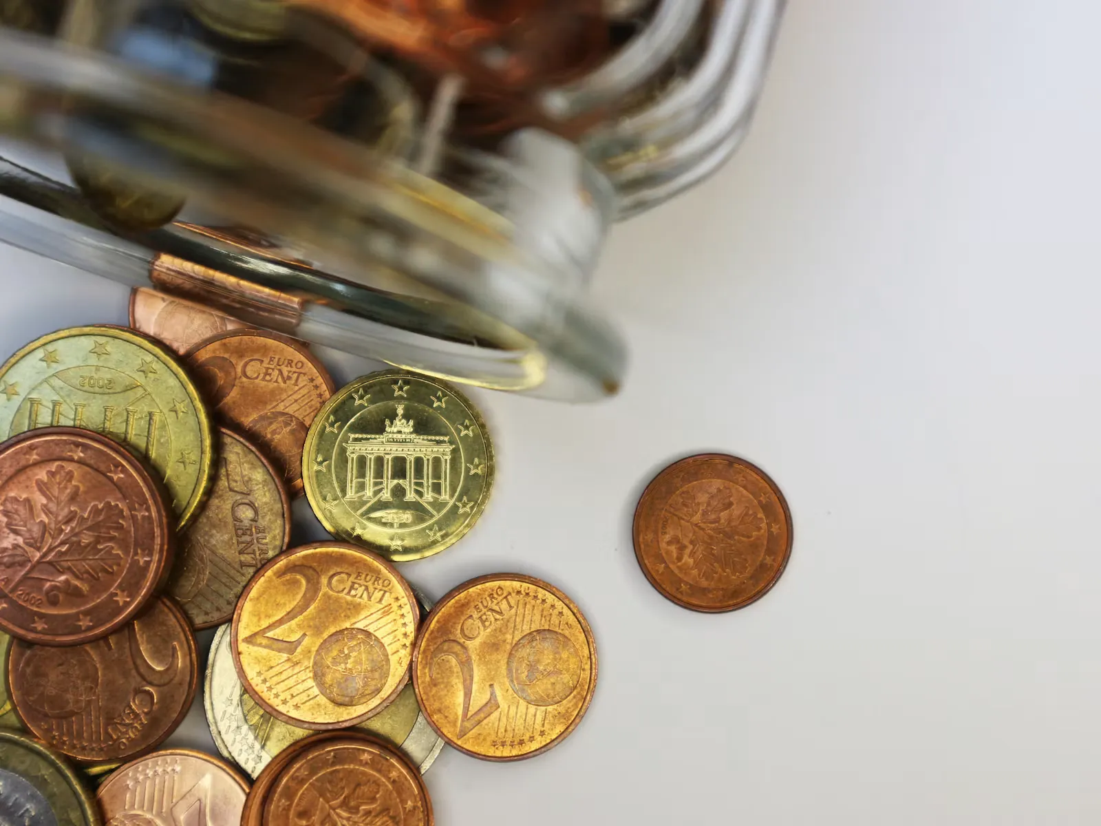 A close-up of gold and silver coins, the budget for a placement abroad