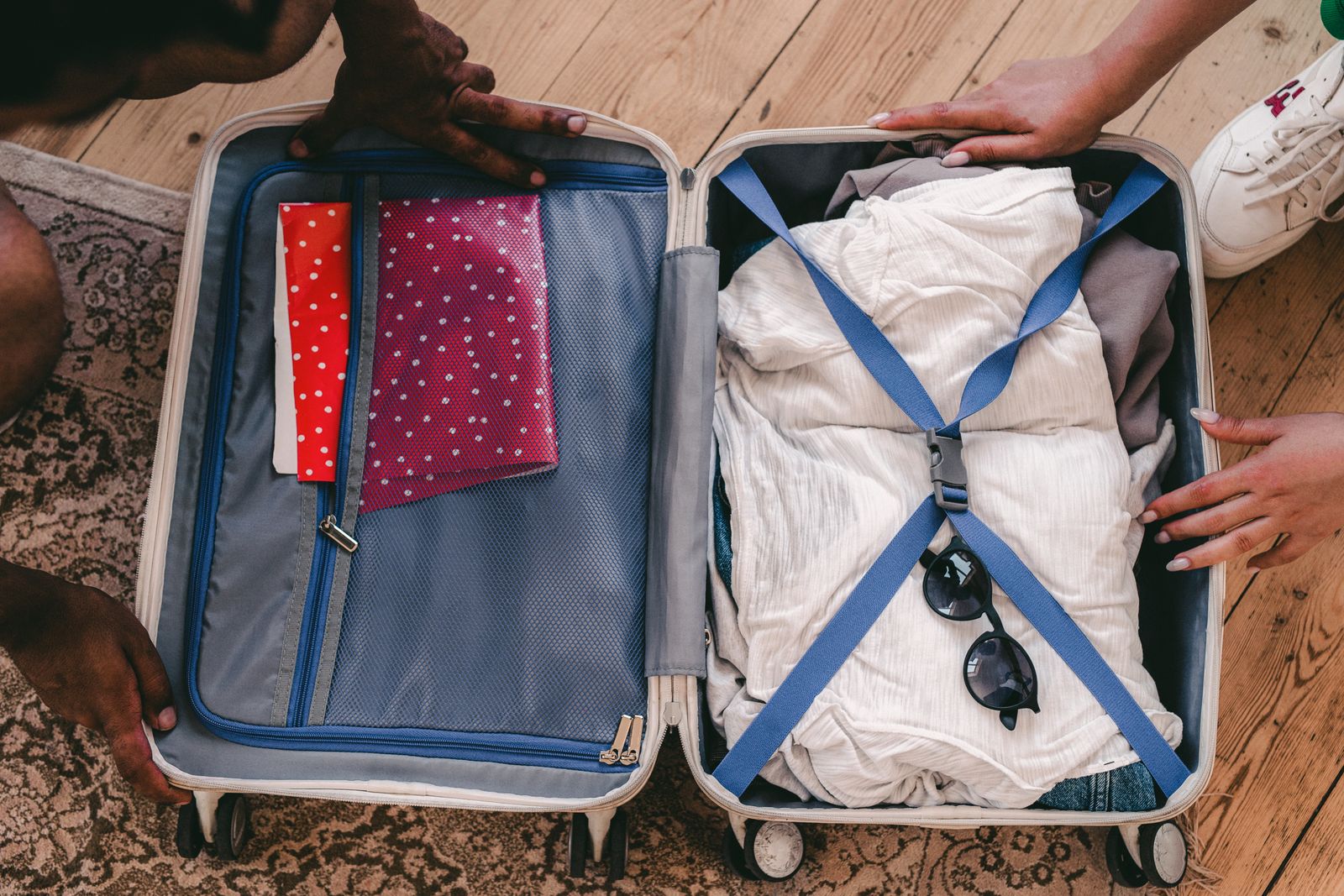 An open suitcase with neatly folded, modest clothing suitable for a culturally respectful stay in Sri Lanka