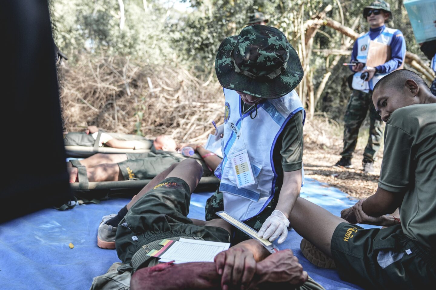 Military doctor in uniform providing medical care