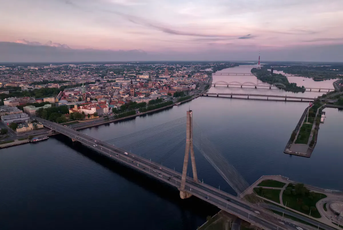 Aerial view of Riga at dusk with the cable-stayed Vansu Bridge over the Daugava river, the Old Town and more bridges in the distance