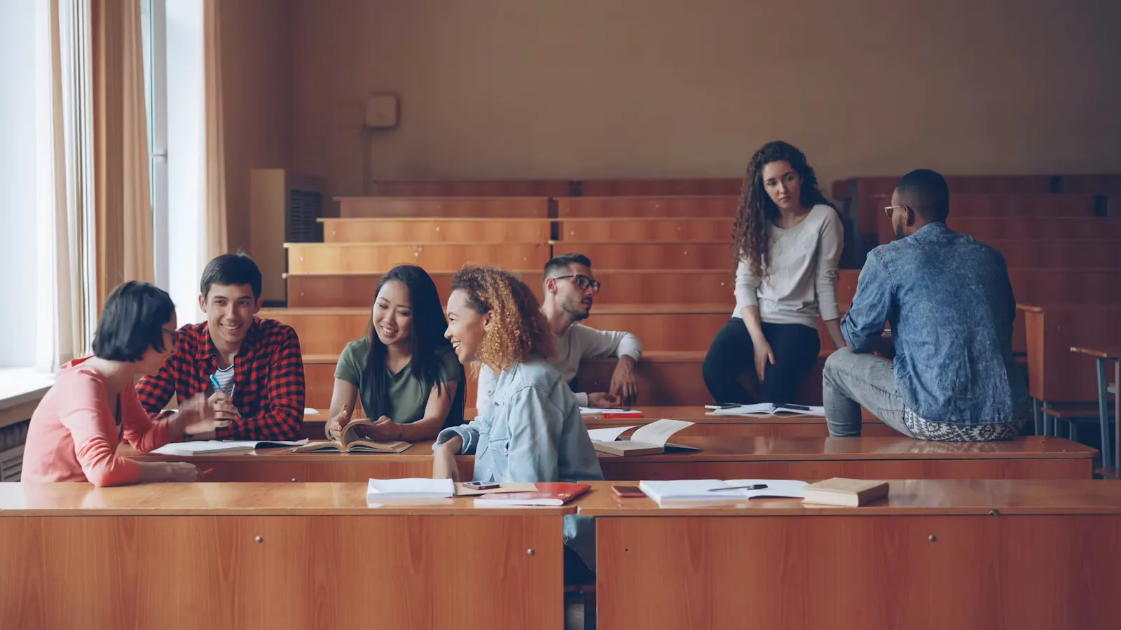 Students talking together in a lecture hall