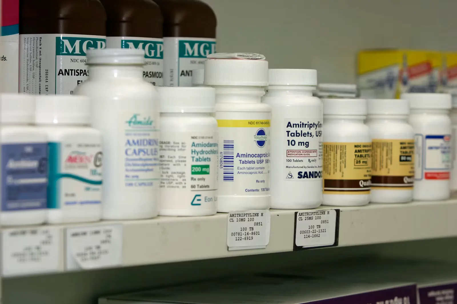 Pharmacy shelves stacked with medicine boxes, representing the pharmacy route among the AYUSH courses after NEET