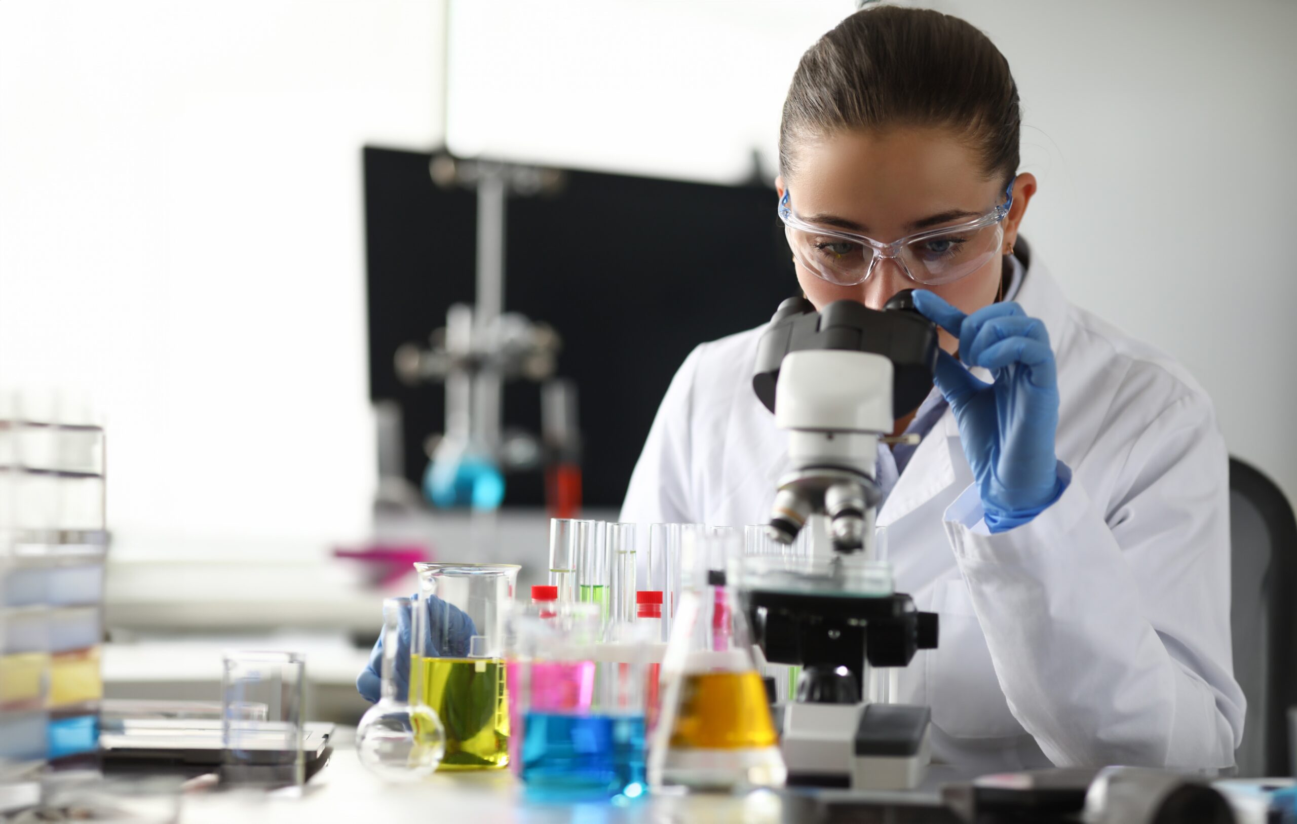 Forensic scientist examining evidence in a lab