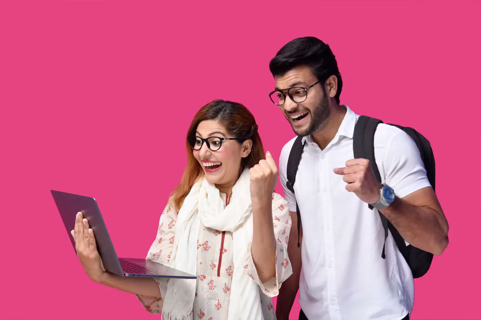 Two students cheering at a laptop screen, the moment a NEET scorecard opens on result day