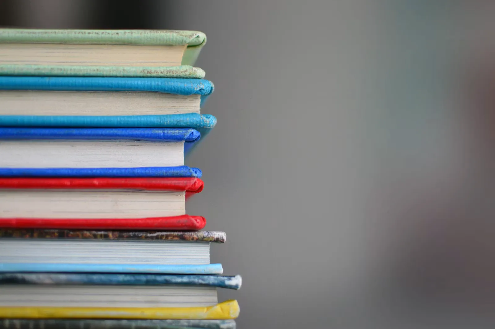A neat stack of NCERT-style textbooks and notebooks, the foundation of a NEET 2027 Class 11 study plan