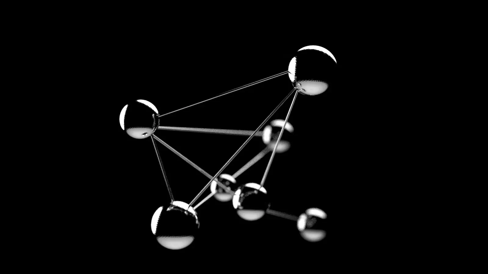 Silver spheres joined by thin rods against a black background, like a model of atoms and the bonds between them