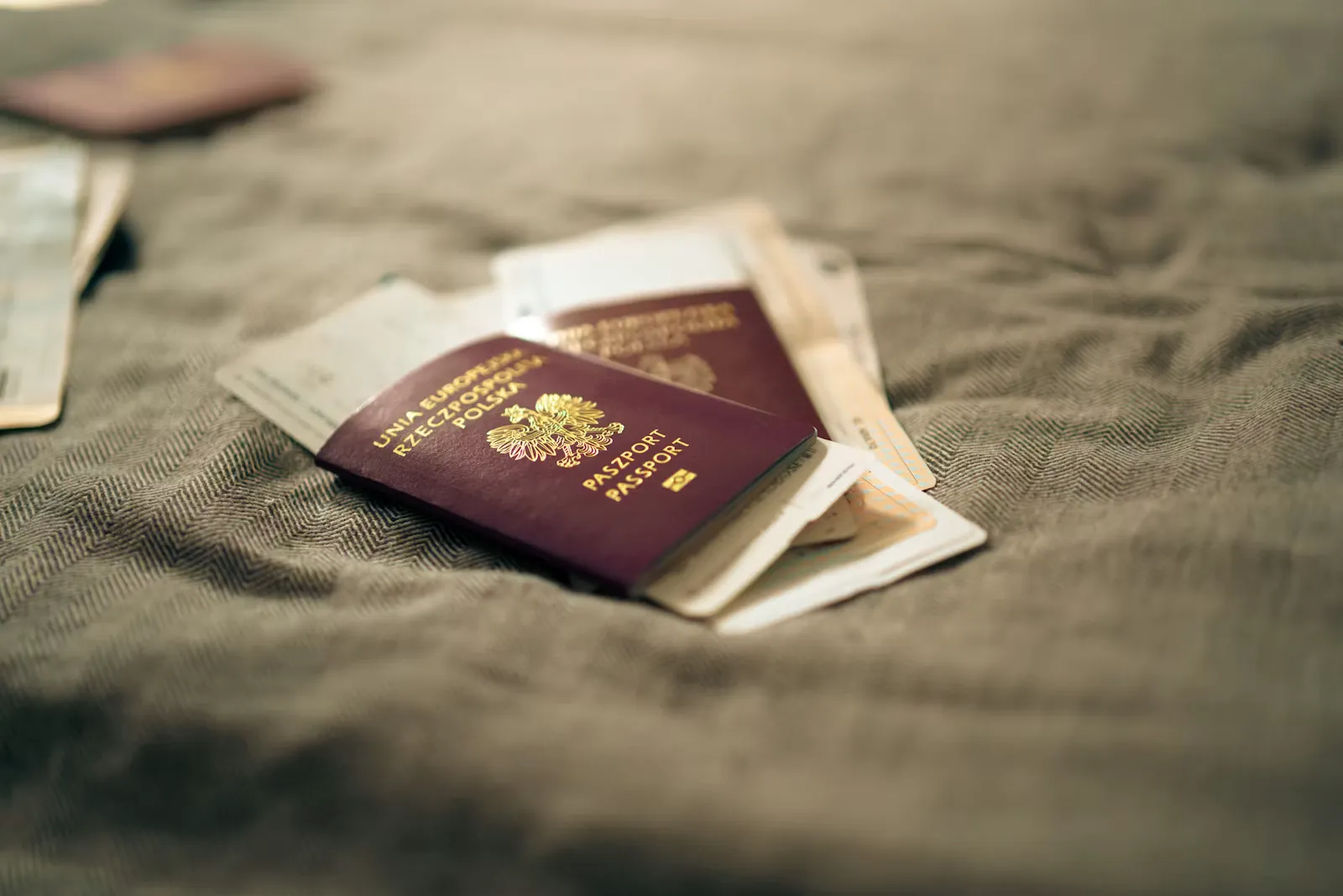 Several passports resting on a table, symbolising the different country-specific application conventions abroad