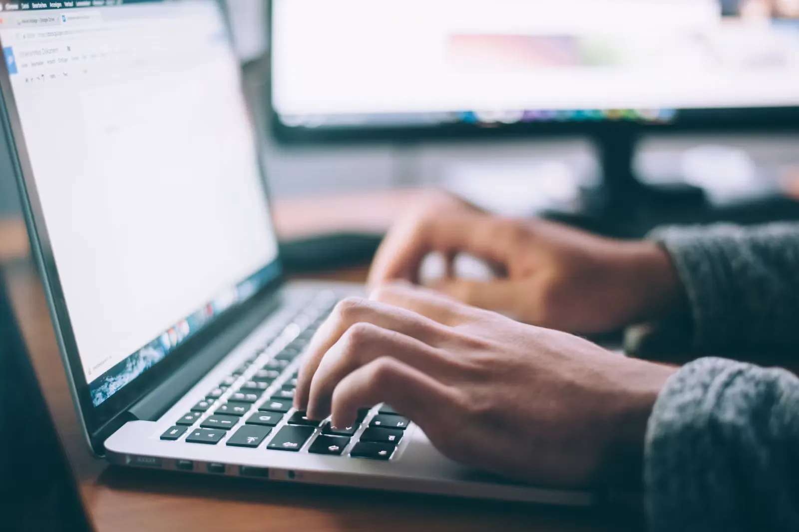 Medical graduate editing a residency personal statement draft on a laptop