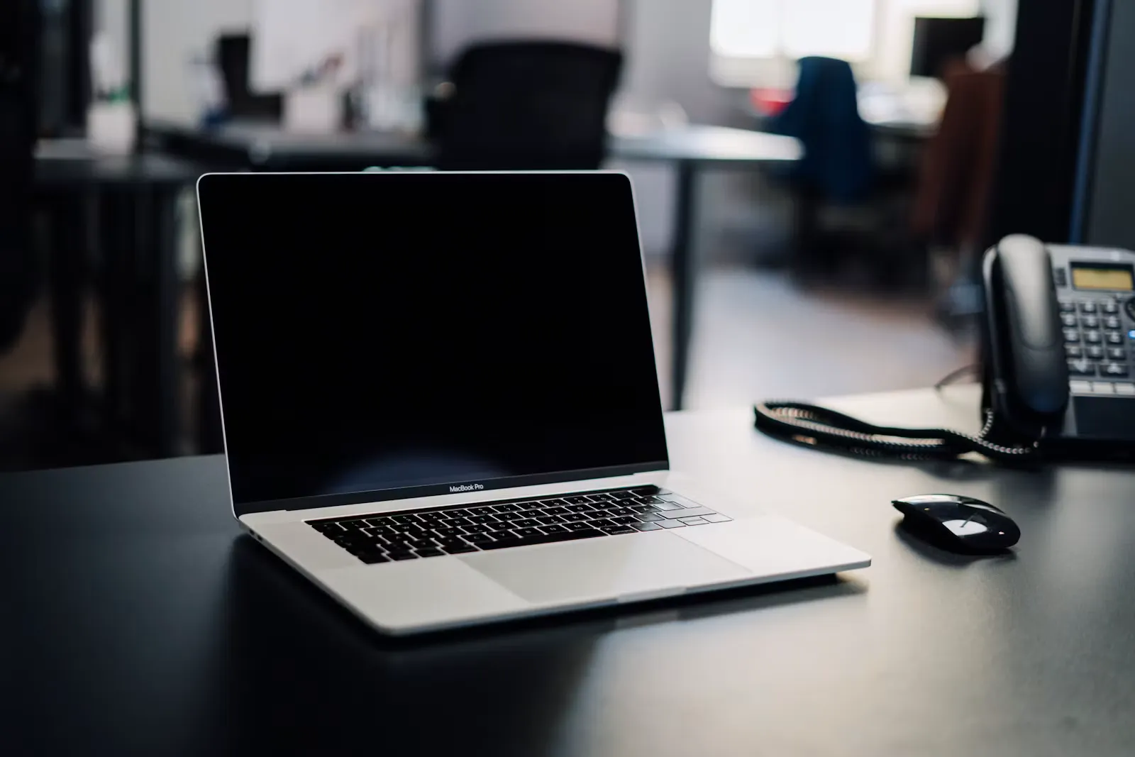 An open laptop on a desk in an office, representing the virtual interview setup many residency programs now use for the 2027 cycle